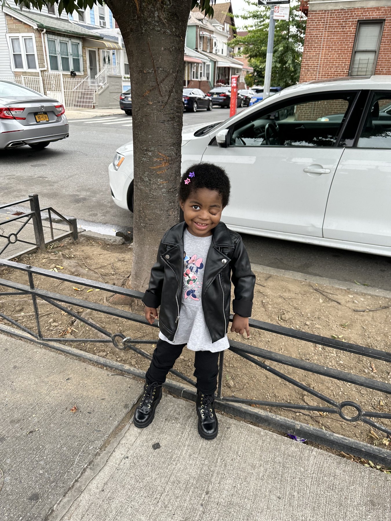 Portrait of Carlene O.J. Samuels smiling outdoors in a black jacket